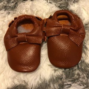 Brown bow moccasins